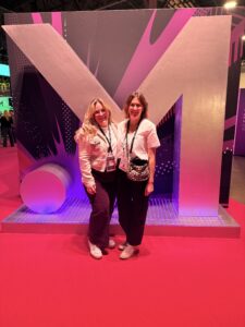 Gabie Kur and Liv Allen standing at the entrance to the Money 20/20 conference floor